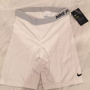 White nike pros cool. Never worn. Size M.